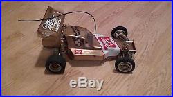 2 Vintage Team Associated RC10 RC buggy (1) A Stamp RC-10 Radio control gold pan