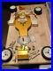 Rare-Vintage-Team-Associated-Rc-10-Old-Gold-Pan-Buggy-Parts-Car-With-Extras-01-kqx