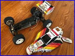 Vintage KYOSHO OPTIMA MID 4WD RC buggy car. Sold as-is for repair or parts