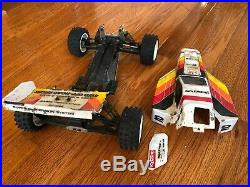 Vintage KYOSHO OPTIMA MID 4WD RC buggy car. Sold as-is for repair or parts