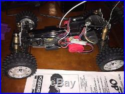 Vintage Kyosho Optima Mid 4WD Off-Road Racer RC Race Car with extra parts car