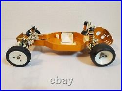 Vintage rc10 Team Associated gold pan RC Car CHASSIS PARTS CAR