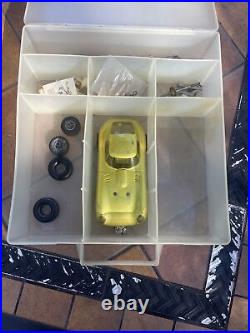 Vintage slot car with case parts AWD Make