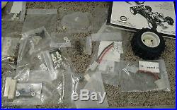 Vintage team associated rc10 gold base unused with a ton of sealed parts box