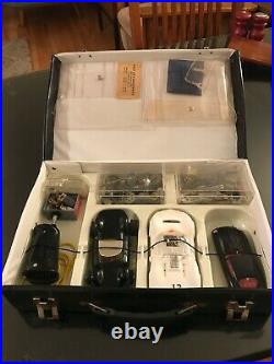 Vintage white Chaparral Cox Slot car, and case full of parts